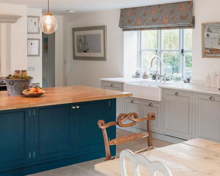 mobile kitchen island and bespoke kitchen fitted with handmade cabinets