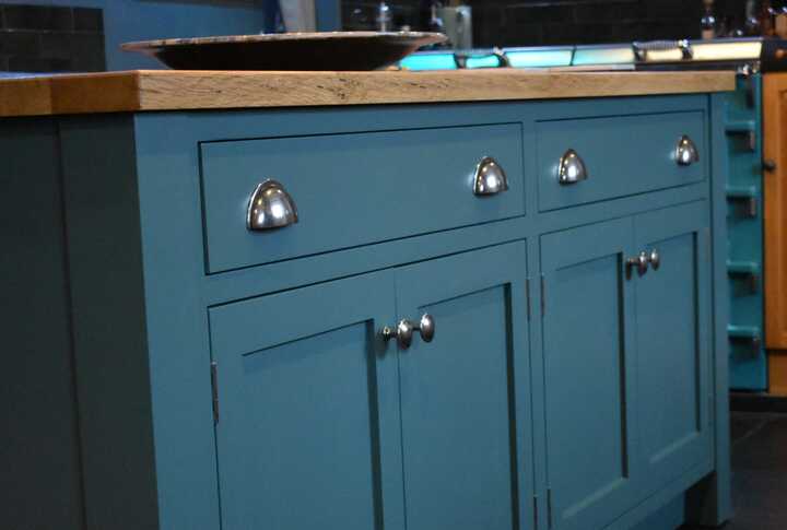 handmade blue cabinets on a mobile kitchen island