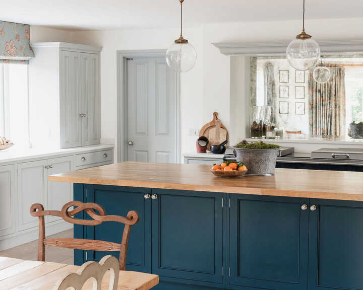 mobile kitchen island and bespoke kitchen fitted with handmade cabinets