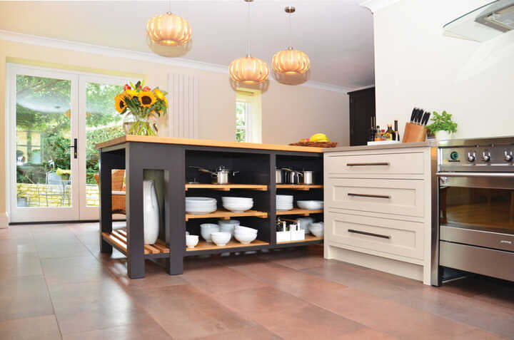 mobile kitchen island and bespoke kitchen fitted with handmade cabinets