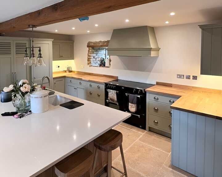 mobile kitchen island and bespoke kitchen fitted with handmade cabinets